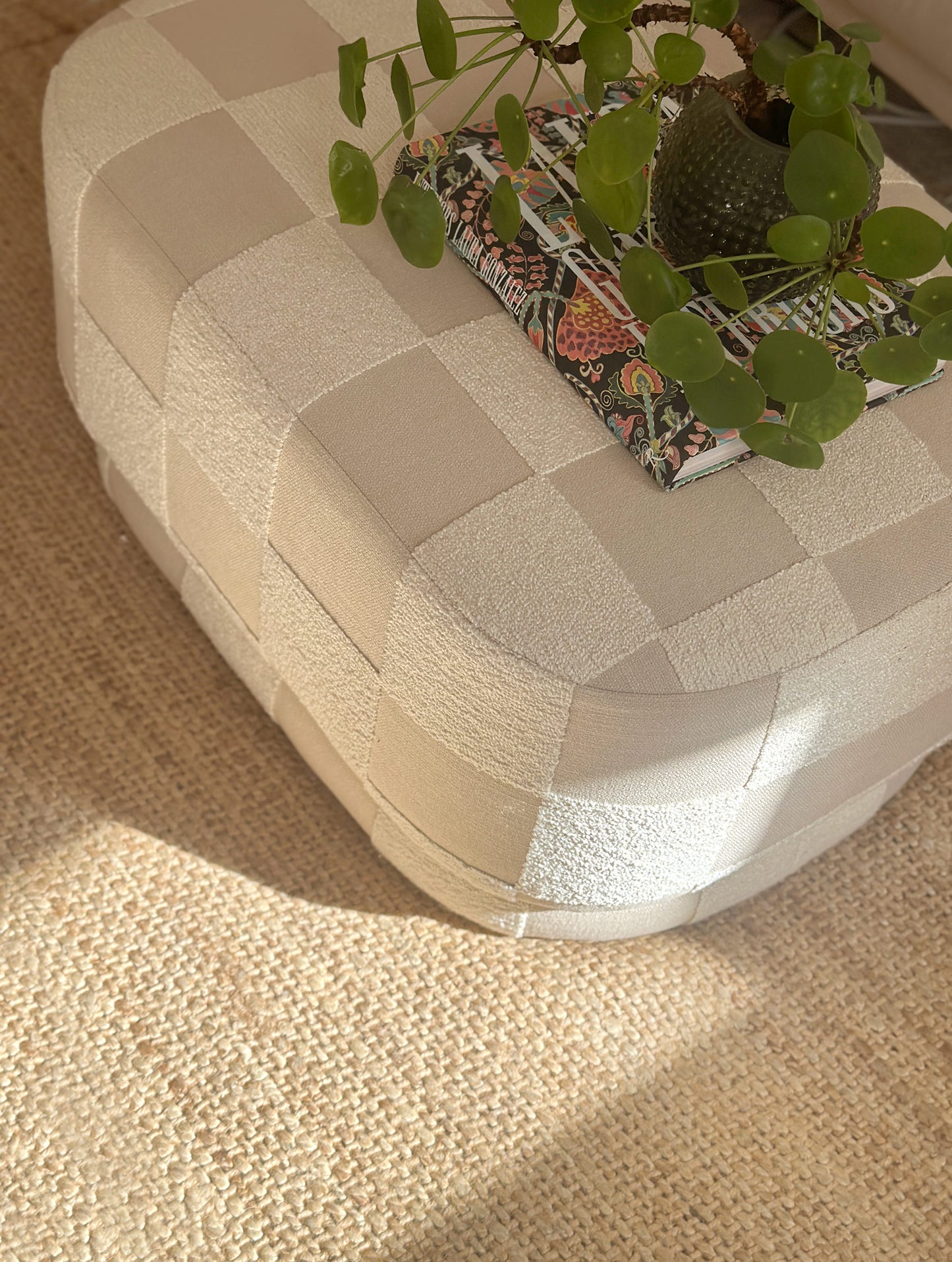 Large designer ottoman used as a coffee table, Onix pouf in geometric checkerboard upholstery by OPALA Home Talismans 