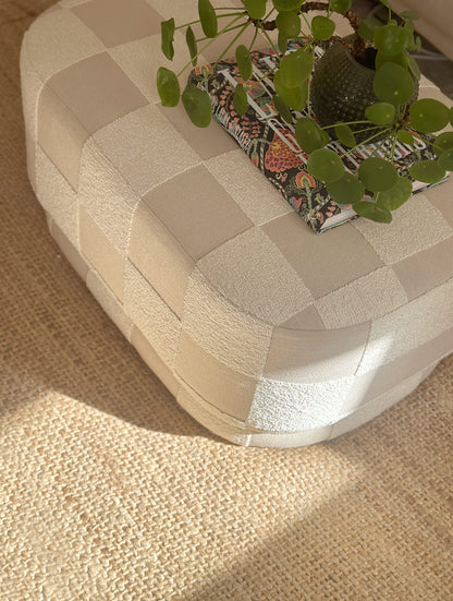Large designer ottoman used as a coffee table, Onix pouf in geometric checkerboard upholstery by OPALA Home Talismans 